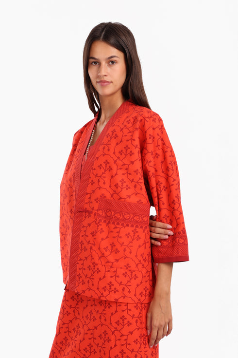 Short jacket in printed cotton with one front button and side slits